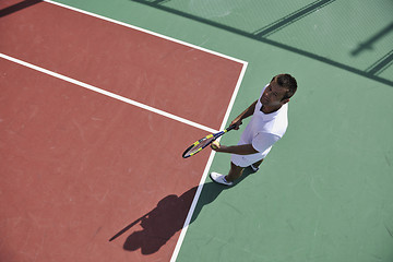 Image showing young man play tennis outdoor