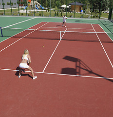 Image showing young woman play tennis game outdoor