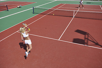 Image showing young woman play tennis game outdoor