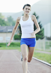 Image showing woman jogging at early morning 