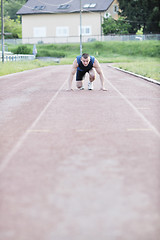 Image showing young athlete on start
