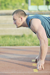 Image showing young athlete on start