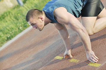 Image showing young athlete on start