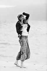 Image showing beautiful young woman on beach with scarf