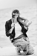 Image showing beautiful young woman on beach with scarf