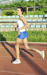 Image showing woman jogging at early morning 