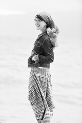 Image showing beautiful young woman on beach with scarf