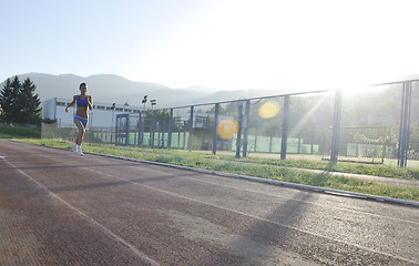 Image showing woman jogging at early morning 