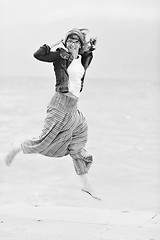 Image showing beautiful young woman on beach with scarf