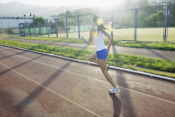 Image showing woman jogging at early morning