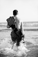 Image showing Portrait of a young  kitsurf  man at beach on sunset