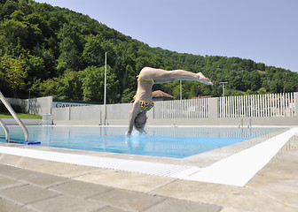 Image showing beautiful woman relax on swimming pool