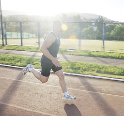 Image showing woman jogging at early morning