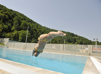 Image showing beautiful woman relax on swimming pool