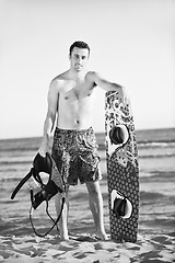 Image showing Portrait of a young  kitsurf  man at beach on sunset