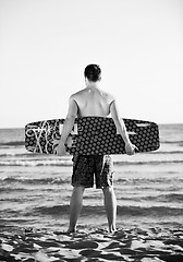 Image showing Portrait of a young  kitsurf  man at beach on sunset