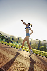 Image showing woman jogging at early morning 