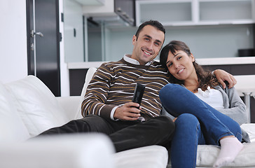 Image showing Relaxed young  couple watching tv at home