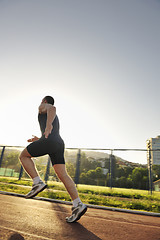 Image showing young athlete running