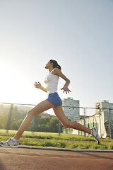 Image showing woman jogging at early morning