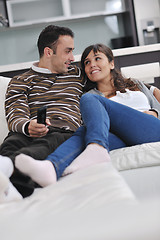 Image showing Relaxed young  couple watching tv at home