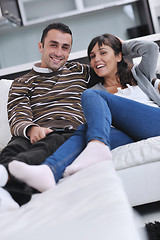 Image showing Relaxed young  couple watching tv at home