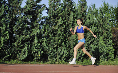 Image showing woman jogging at early morning 