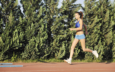 Image showing woman jogging at early morning