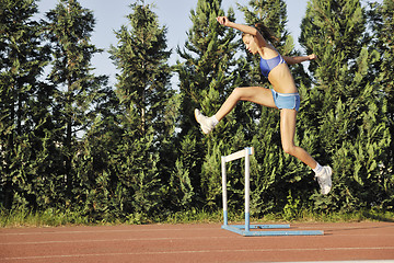 Image showing woman jogging at early morning