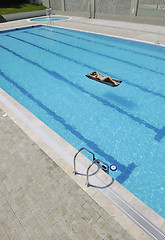 Image showing woman relax on swimming pool