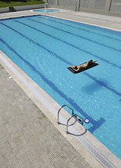 Image showing beautiful woman relax on swimming pool