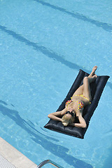 Image showing beautiful woman relax on swimming pool