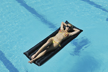 Image showing woman relax on swimming pool