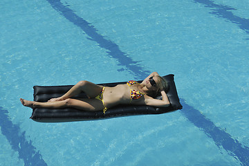 Image showing beautiful woman relax on swimming pool