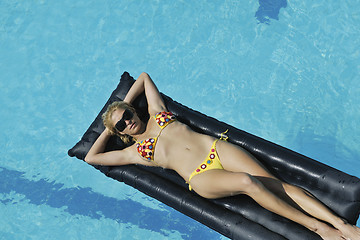 Image showing woman relax on swimming pool