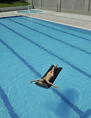 Image showing beautiful woman relax on swimming pool