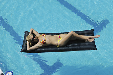 Image showing woman relax on swimming pool