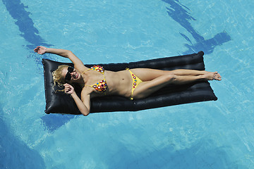 Image showing woman relax on swimming pool