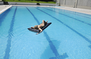 Image showing woman relax on swimming pool