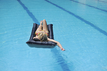 Image showing woman relax on swimming pool