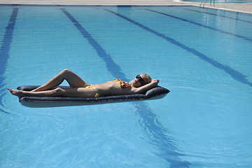 Image showing woman relax on swimming pool