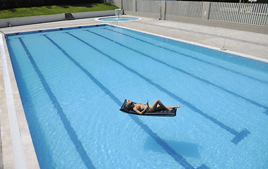 Image showing beautiful woman relax on swimming pool