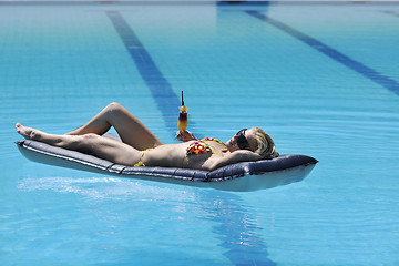 Image showing woman relax on swimming pool