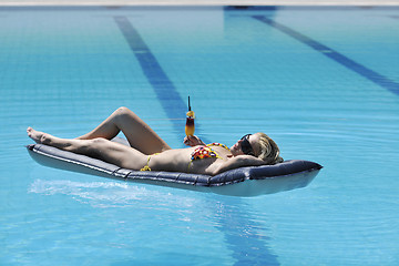 Image showing woman relax on swimming pool