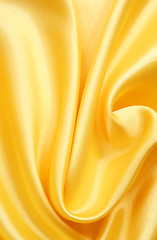 Image showing Smooth elegant golden silk can use as background 