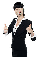 Image showing Gorgeous telecaller showing double thumbs up