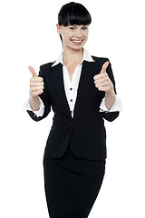 Image showing Successful businesswoman gesturing thumbs up