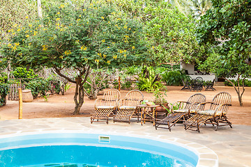 Image showing Chairs on swimming pool border