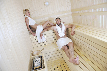 Image showing happy young couple in sauna