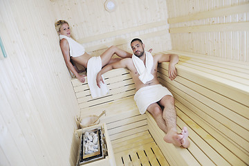 Image showing happy young couple in sauna